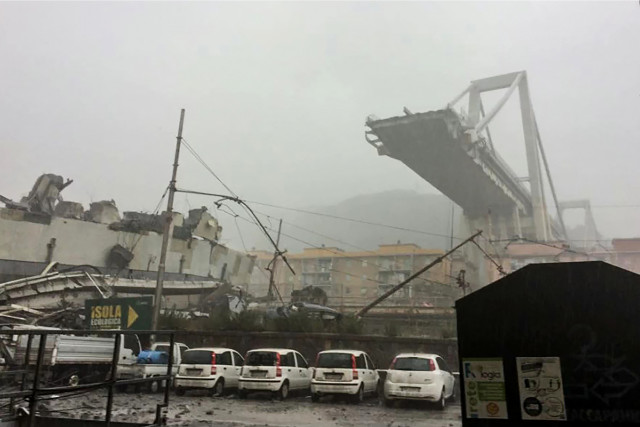First images of the collapsed bridge provided by the Italian police show the viaduct in the mist with a huge chunk missing. Photo: Handout / Italian Police / AFP